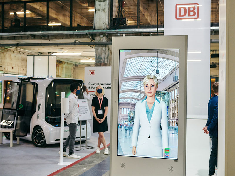 Deutsche Bahn SEMMI avatar on a digital terminal